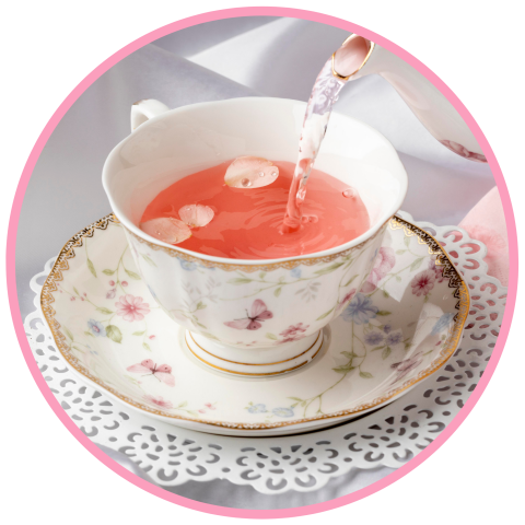 Tea pouring into a teacup