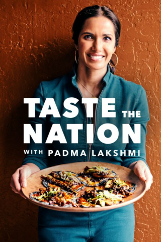 Padma Lakshmi holding a platter of food