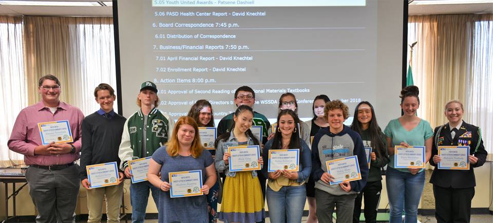 Group of high school students holding certificates