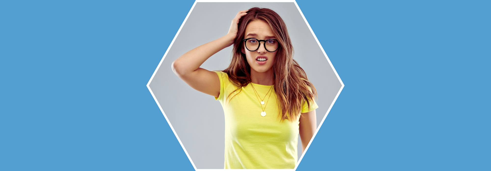 A confused looking woman on a blue background