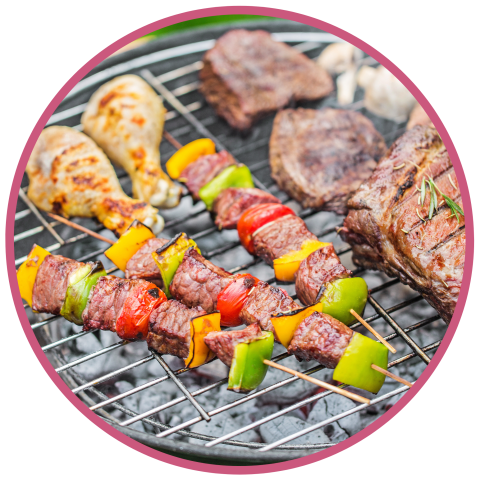 Kebabs and steak on a grill