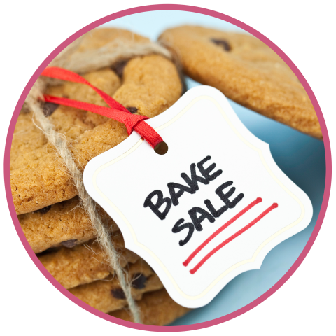 Stack of cookies with sign reading Bake Sale