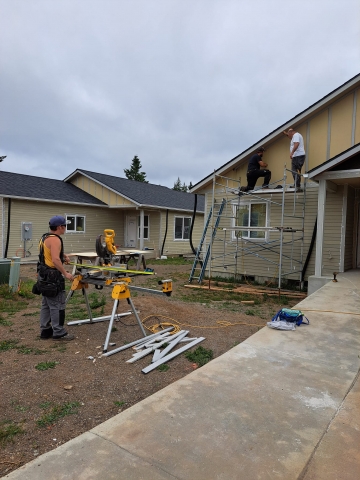 People building a house