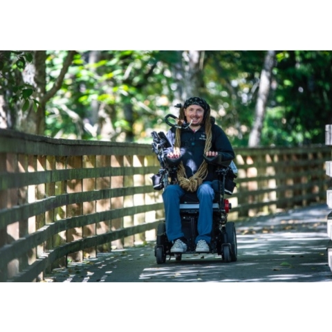 Man in wheelchair on bridge