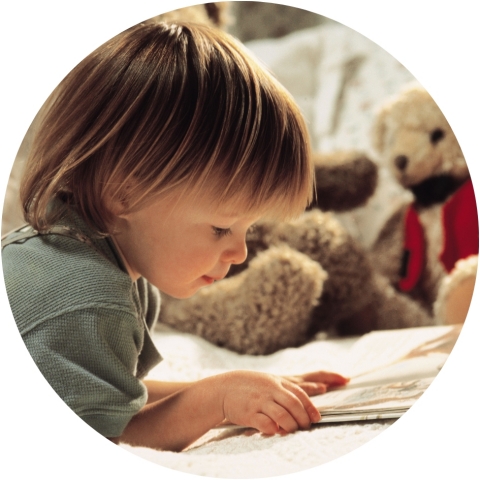 Young child looking at an open book