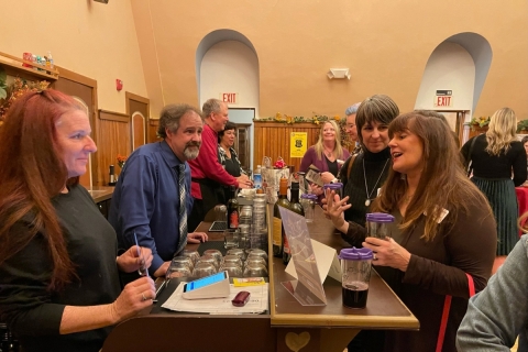 Group of people gathered around a bar