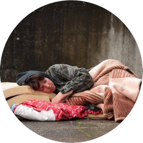 Homeless woman sleeping on the street