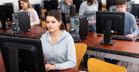 Female student sitting at computer