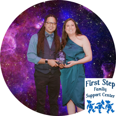 Two people in front of a space background holding an award