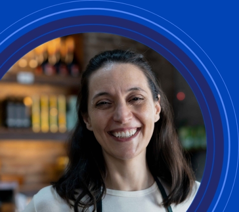 Smiling woman inside concentric blue circles