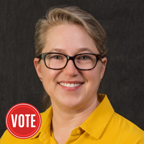 smiling woman in yellow shirt