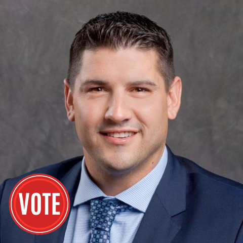 headshot of young man in suit
