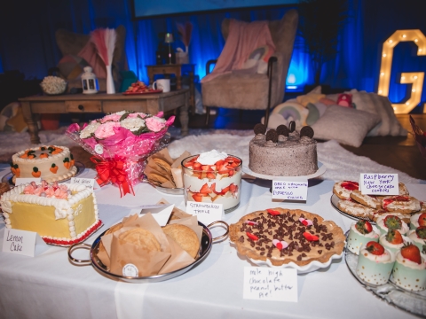 table covered in desserts