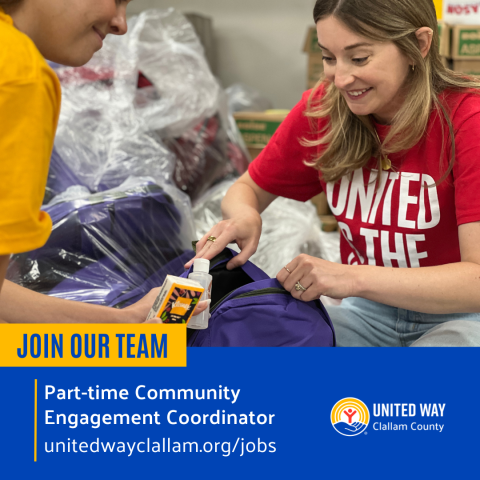 Two people stuffing an emergency response bag