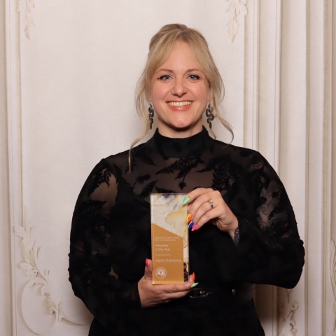 woman holding award