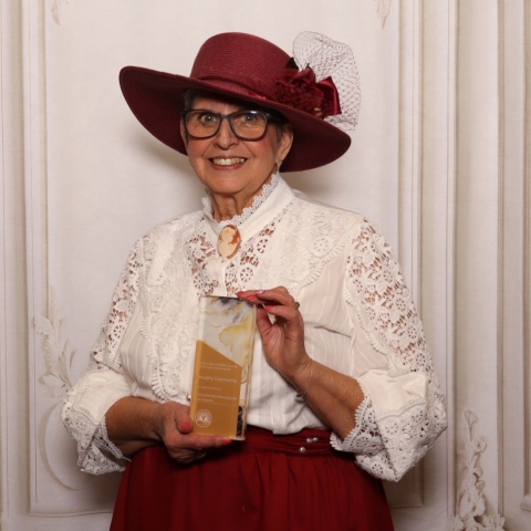 woman holding award