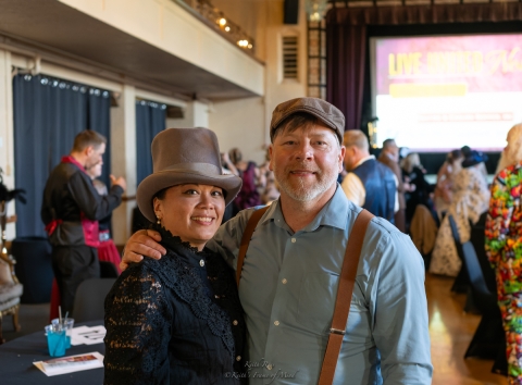 a couple dressed in retro clothing at an evening event