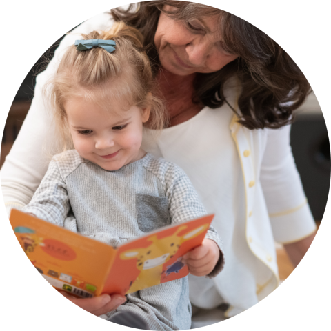 woman reading to young girl