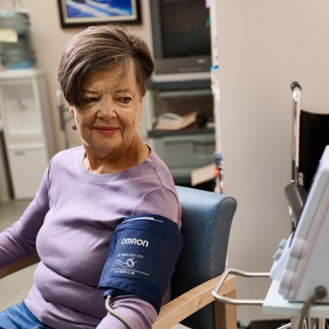 a woman having her blood pressure taken