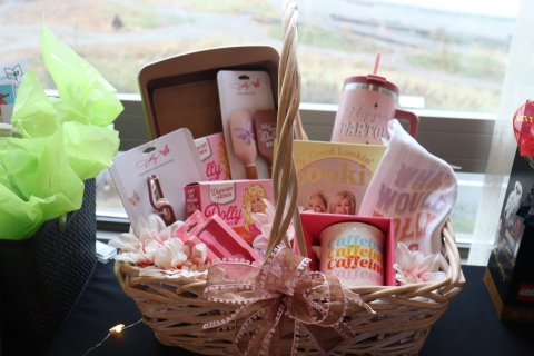 Basket filled with pink Dolly Parton baking items