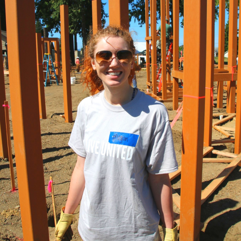 Smiling woman in a construction area