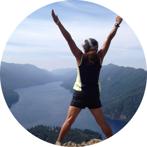 woman on top of a mountain